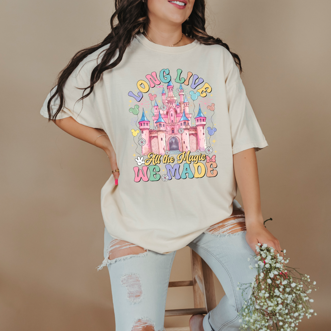 Customized adult comfort colors Ivory t-shirt with long live multi color long live bubble letters large castle in the middle with Mickey Mouse shaped balloons and flowers surrounding. Matching crewnecks and hoodies available in youth and adult sizes