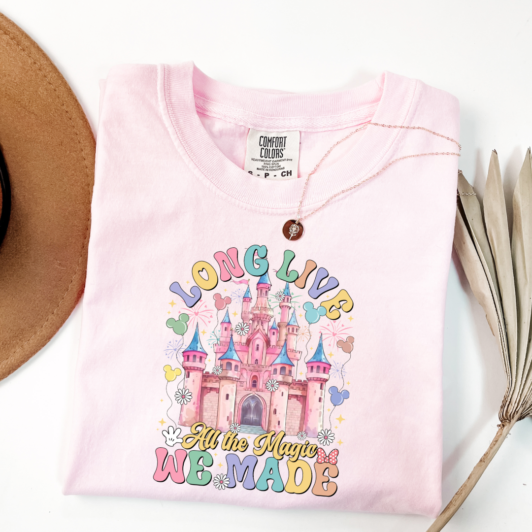 Customized adult comfort colors Blossom Pink t-shirt with long live multi color long live bubble letters large castle in the middle with Mickey Mouse shaped balloons and flowers surrounding. Matching crewnecks and hoodies available available in youth and adult sizes