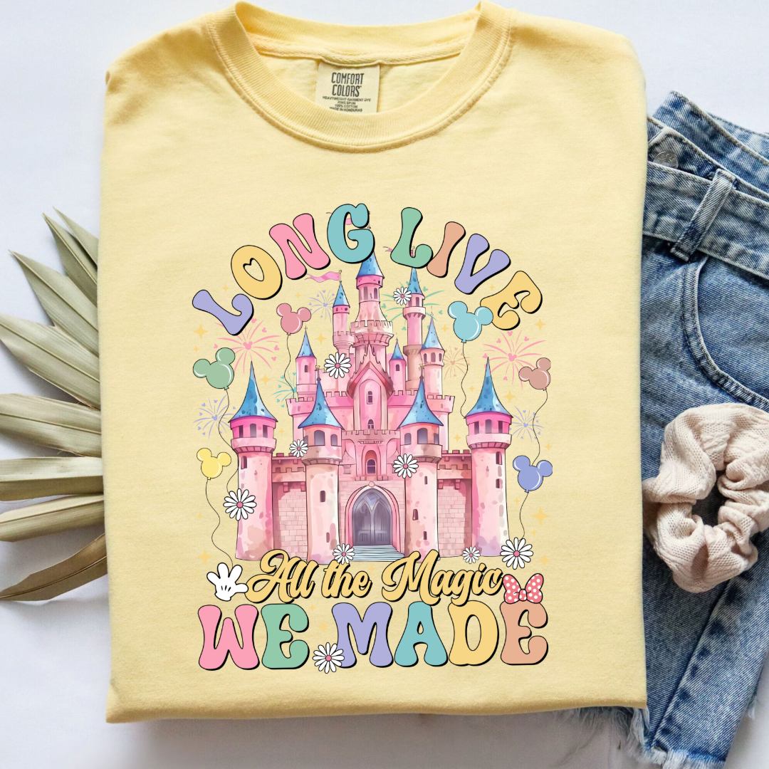 Customized adult comfort colors Butter yellow t-shirt with long live multi color long live bubble letters large castle in the middle with Mickey Mouse shaped balloons and flowers surrounding. Matching crewnecks and hoodies available in youth and adult sizes