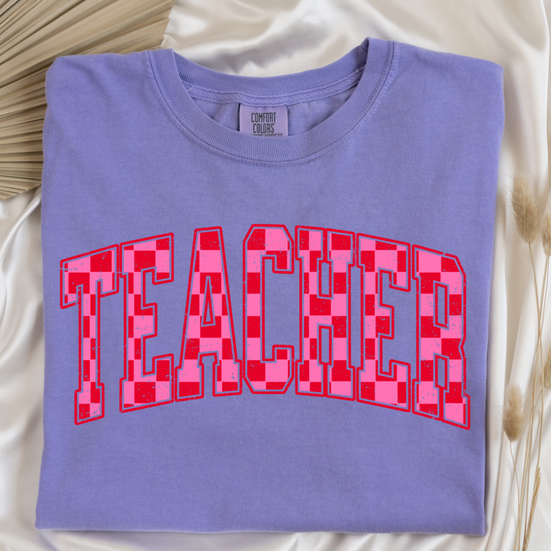Customized Adult Violet Graphic tee with pink and red checkered teacher varsity font