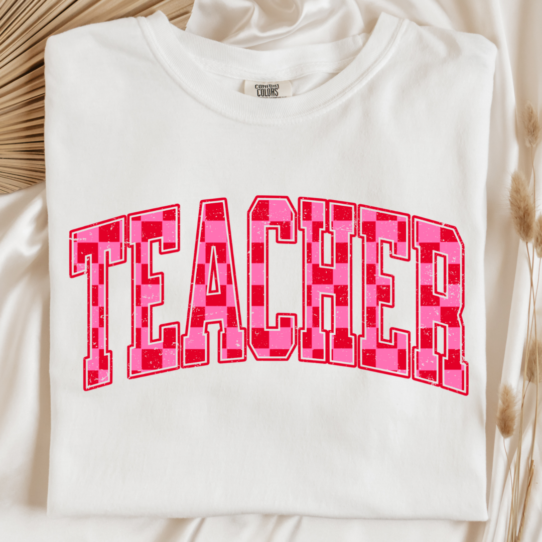 Customized Adult White Graphic tee with pink and red checkered teacher varsity font