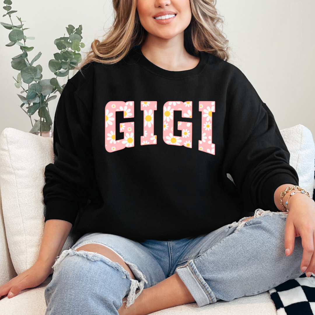 Customized Black Crewneck with varsity letter font GiGi with yellow and pink daisies Matching mama and mini tee and crewneck available.