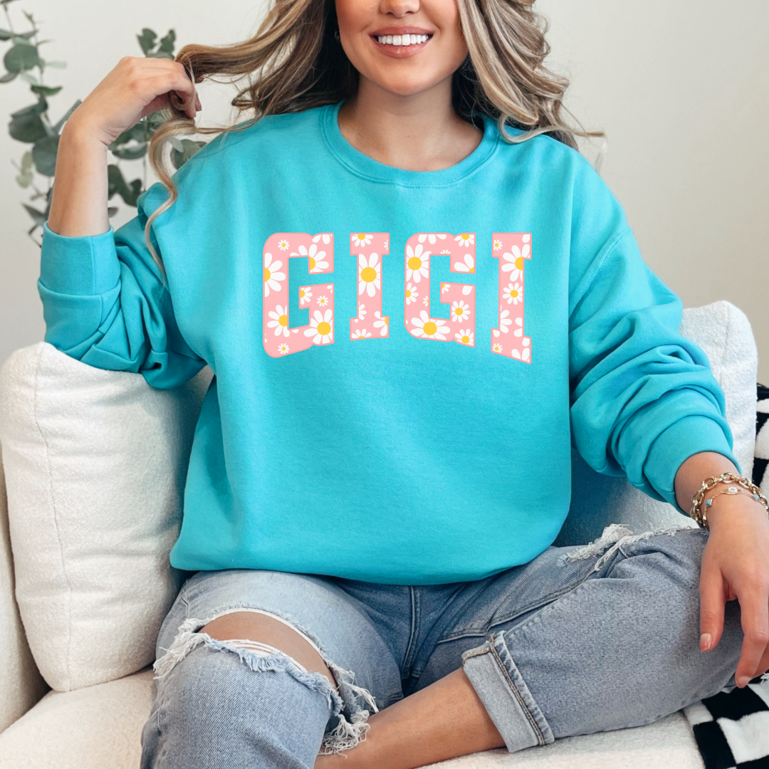 Customized Scuba Blue Crewneck with varsity letter font GiGi with yellow and pink daisies Matching mama and mini tee and crewneck available.
