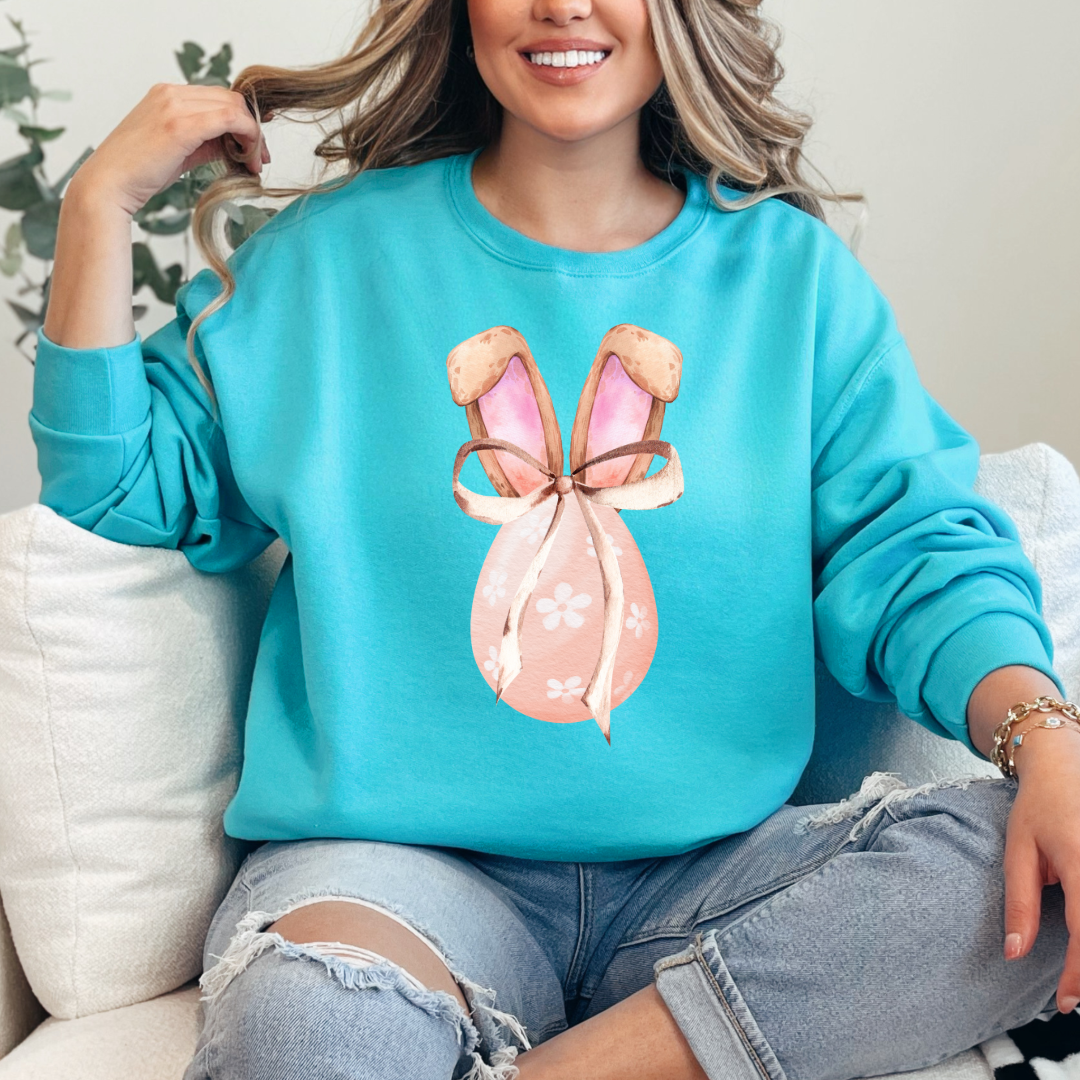 Customized adult scuba blue crewneck watercolor peach egg with white flowers and brown floppy skinny bow and bunny ears matching tees and hoodies available In adult and youth sizes