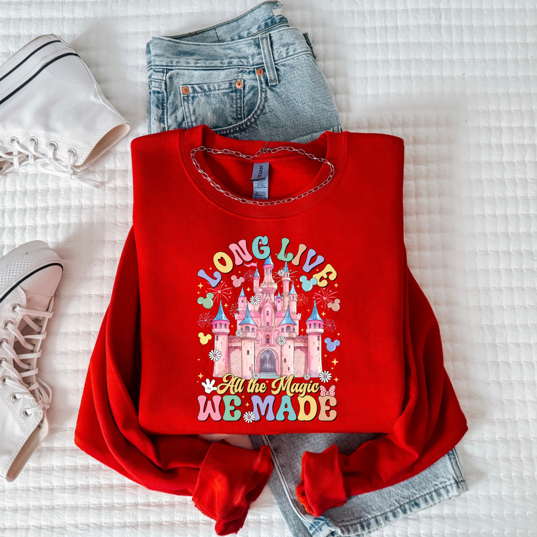 Customized youth red crewneck with long live multi color long live bubble letters large castle in the middle with Mickey Mouse shaped balloons and flowers surrounding. Matching t-shirts and hoodies available in youth and adult sizes