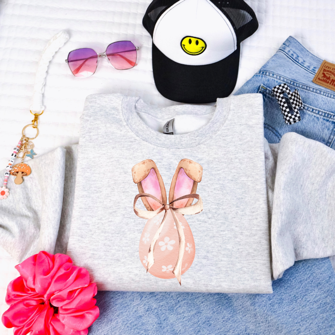 Customized youth grey crewneck watercolor peach egg with white flowers, bunny ears with floppy skinny bow matching tees and hoodies available In adult and youth sizes