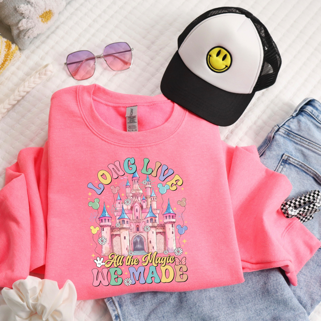 Customized youth hot pink flat lay crewneck with long live multi color long live bubble letters large castle in the middle with Mickey Mouse shaped balloons and flowers surrounding. Matching t-shirts and hoodies available in youth and adult sizes