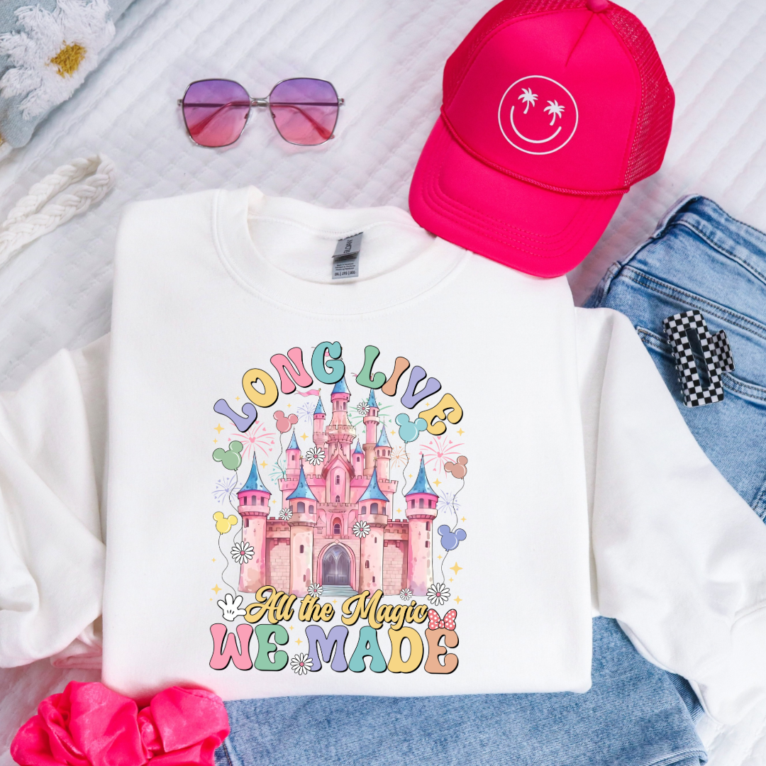 Customized youth white crewneck with long live multi color long live bubble letters large castle in the middle with Mickey Mouse shaped balloons and flowers surrounding. Matching t-shirts and hoodies available in youth and adult sizes
