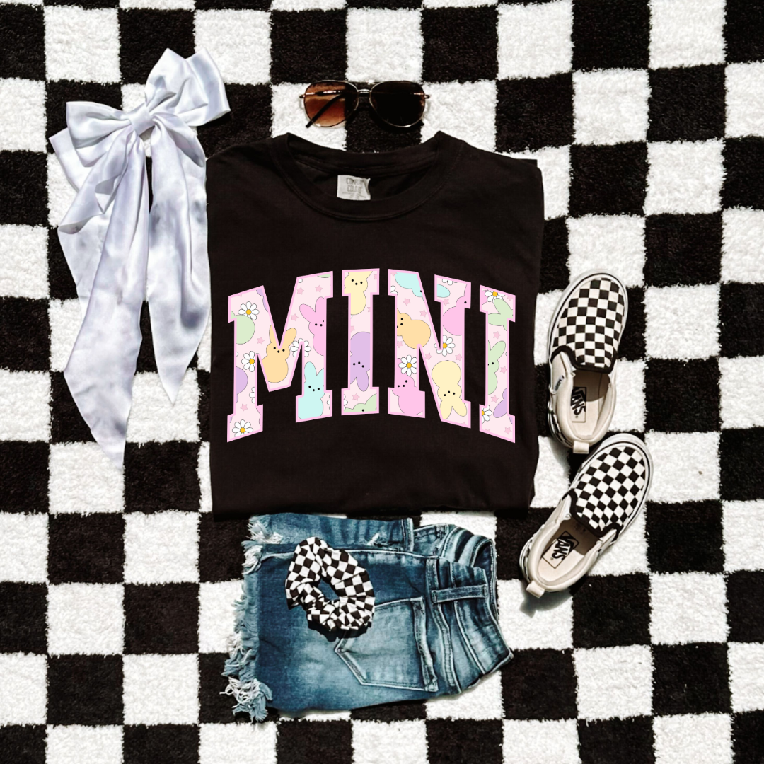 Customized youth mini of a mama and mini matching set varsity lettering with Patel peeps on the inside of the lettering matching youth crewneck available comfort colors black graphic tee