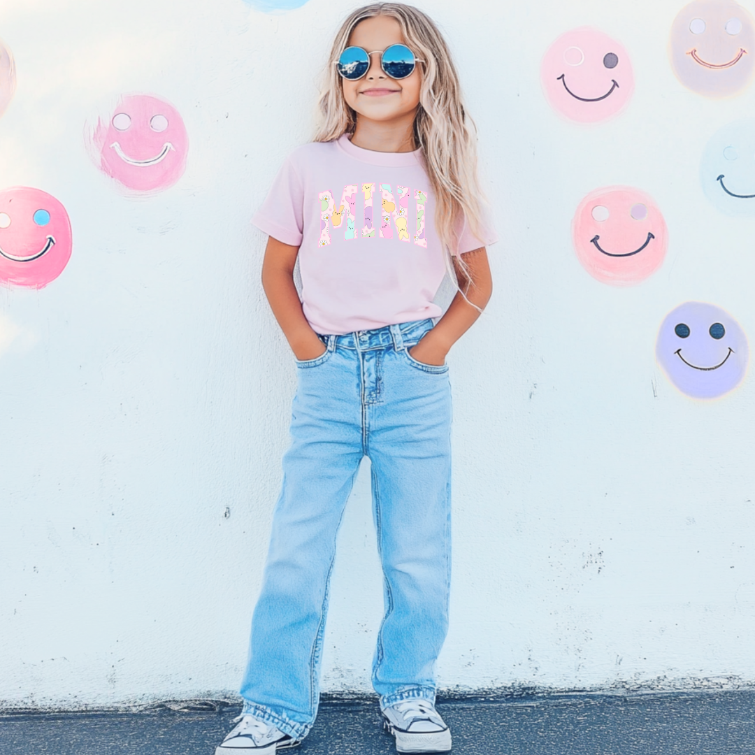 Customized youth mini of a mama and mini matching set varsity lettering with Patel peeps on the inside of the lettering matching youth crewnecks available comfort colors blossom pink graphic tee