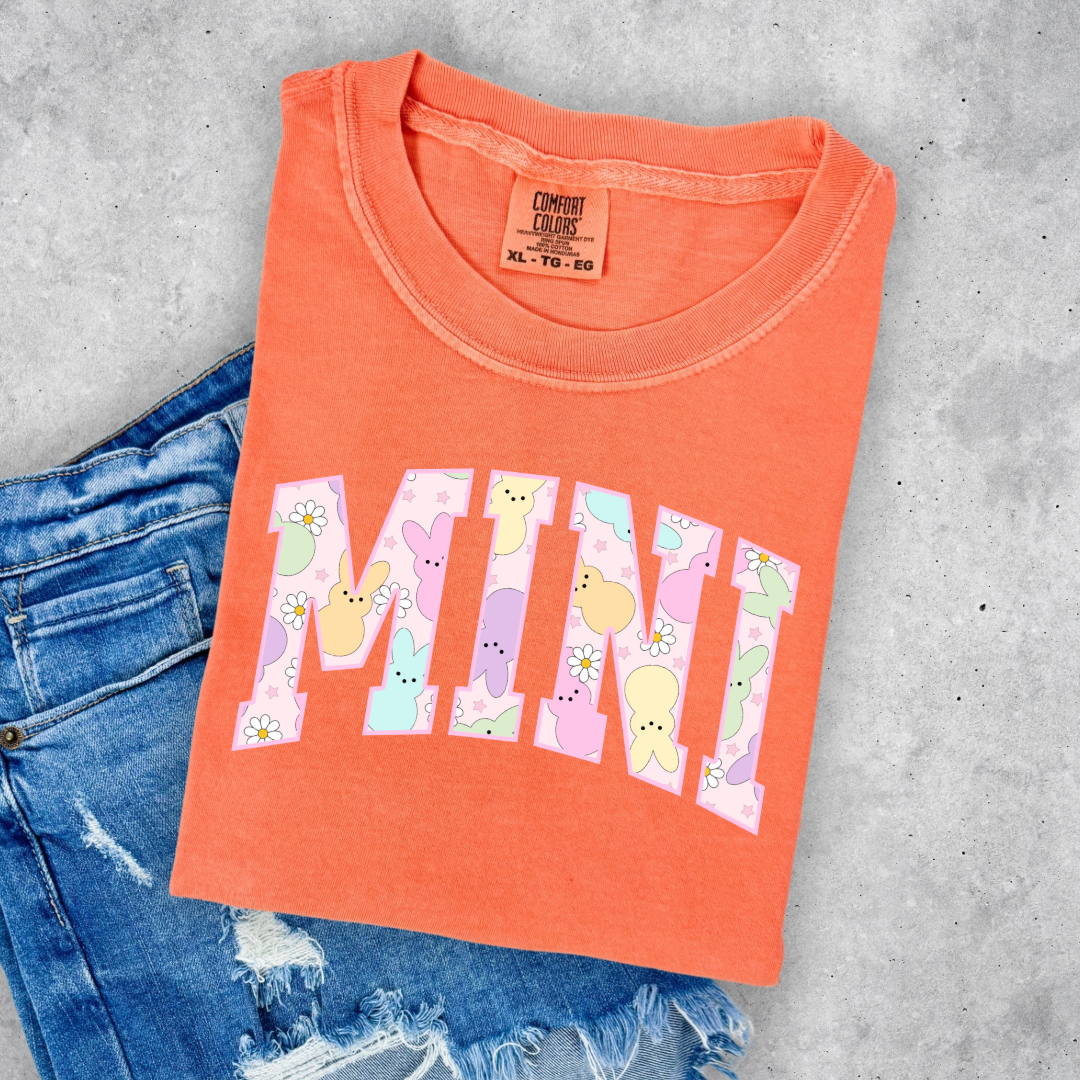 Customized youth mini of a mama and mini matching set varsity lettering with Patel peeps on the inside of the lettering matching youth and adult crewnecks available comfort colors melon graphic tee