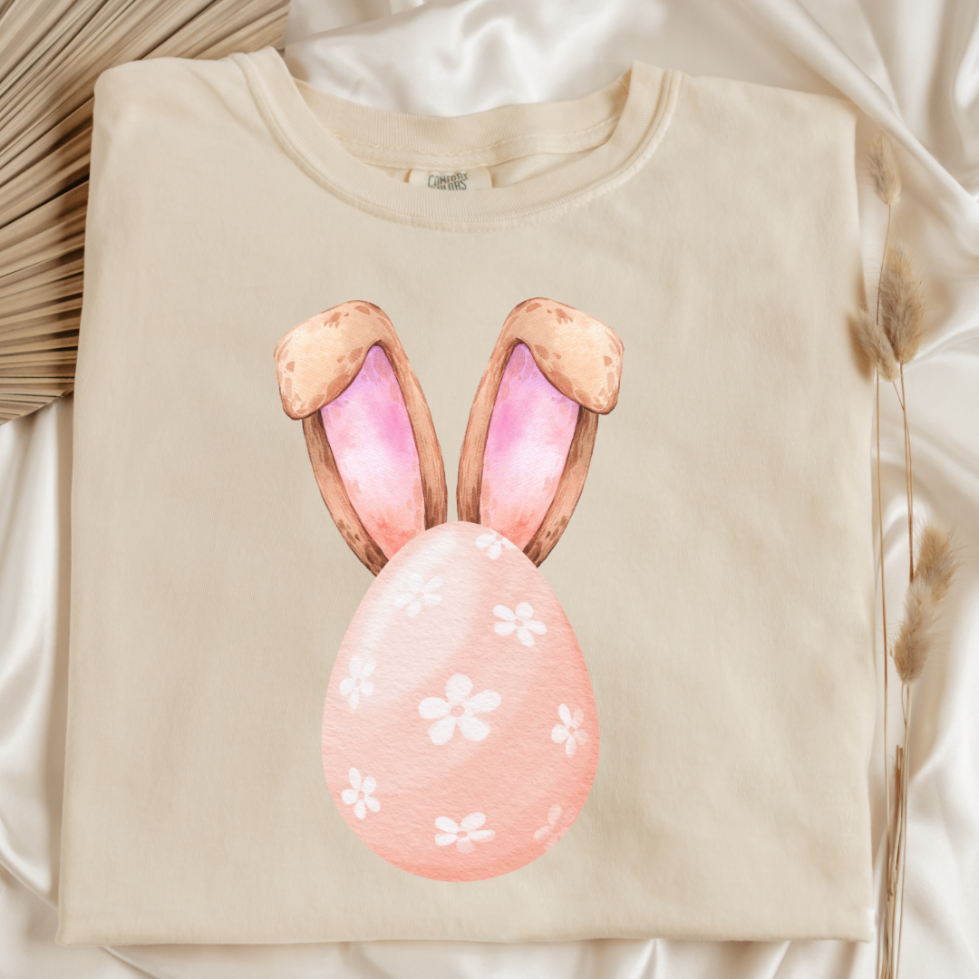 Customized adult comfort colors ivory flatlaywatercolor peach egg with white flowers and bunny ears matching crewneck and hoodies available I’m adult and youth sizes