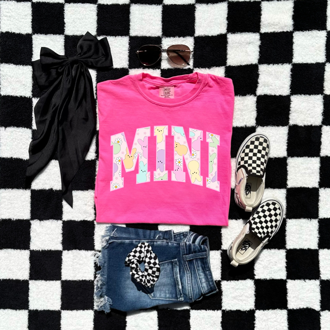 Customized youth mini of a mama and mini matching set varsity lettering with Patel peeps on the inside of the lettering matching youth crewnecks available comfort colors neon pink graphic tee