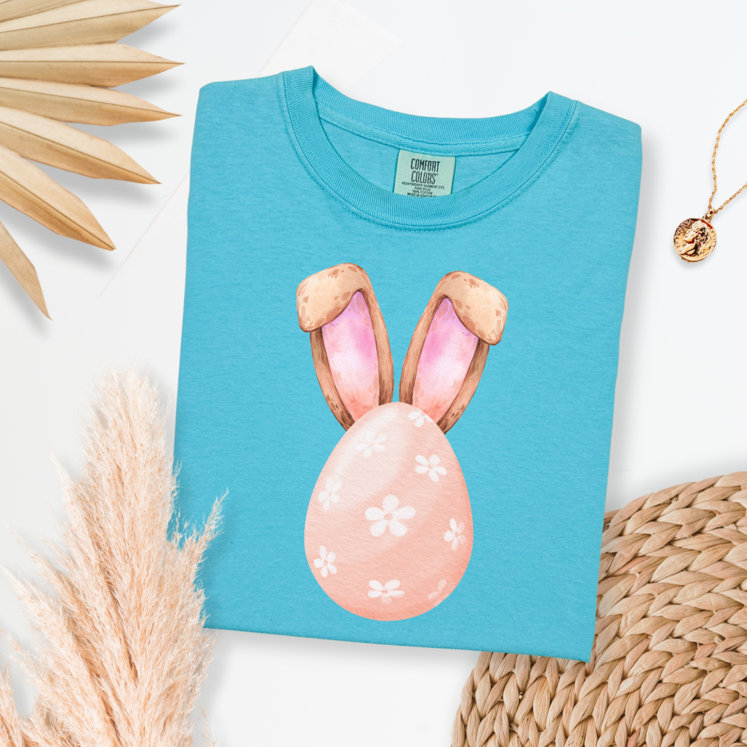 Customized adult comfort colors lagoon blue watercolor peach egg with white flowers and bunny ears matching crewneck and hoodies available I’m adult and youth sizes