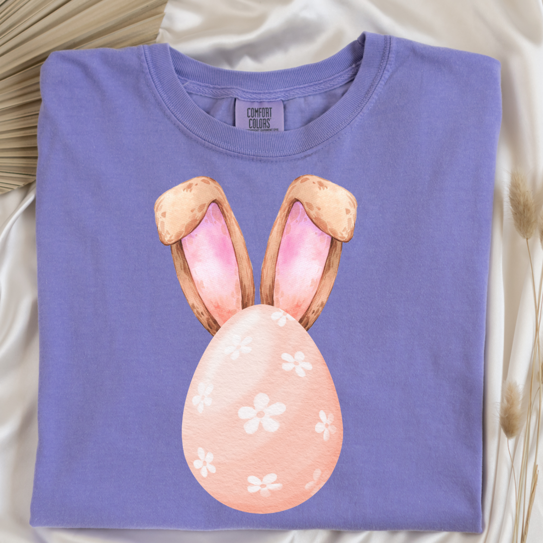 Customized adult comfort colors violet watercolor peach egg with white flowers and bunny ears matching crewneck and hoodies available I’m adult and youth sizes