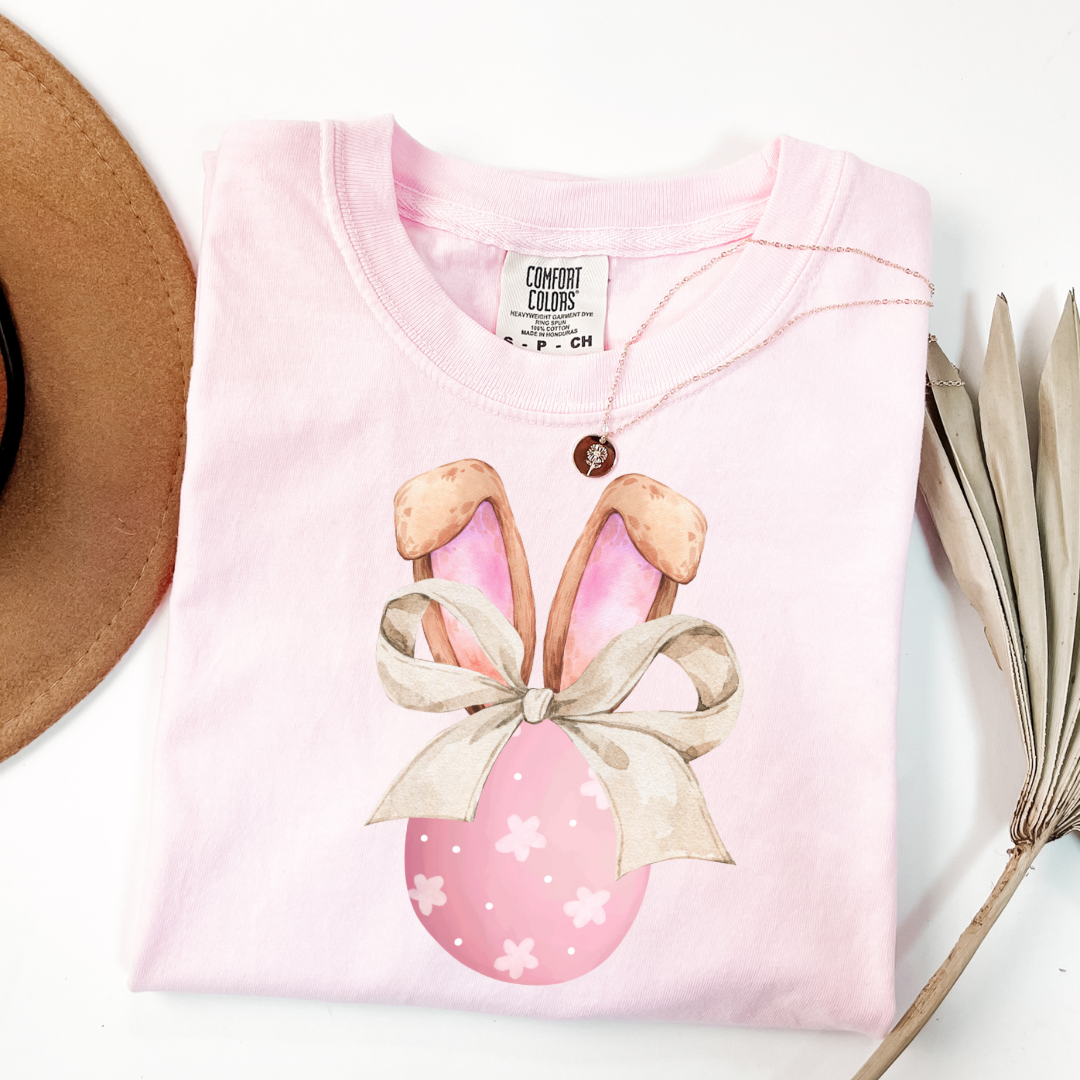 Customized adult comfort colors blossom pink watercolor peach egg with white flowers and brown floppy skinny bow and bunny ears matching crewneck and hoodies available In adult and youth sizes
