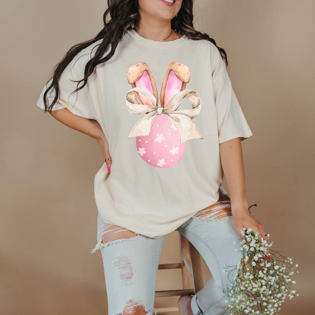 Customized adult comfort colors ivory watercolor peach egg with white flowers and brown floppy skinny bow and bunny ears matching crewneck and hoodies available In adult and youth sizes