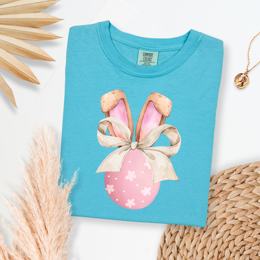 Customized adult comfort colors lagoon blue watercolor peach egg with white flowers and brown floppy skinny bow and bunny ears matching crewneck and hoodies available In adult and youth sizes