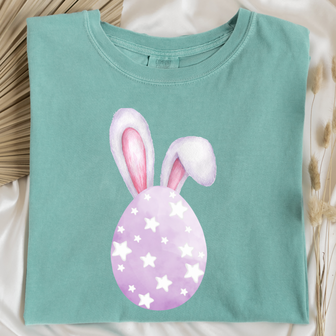Customized adult comfort colors chalky mint graphic tee with purple watercolor egg with white stars matching crewneck and hoodies available in youth and adult sizes