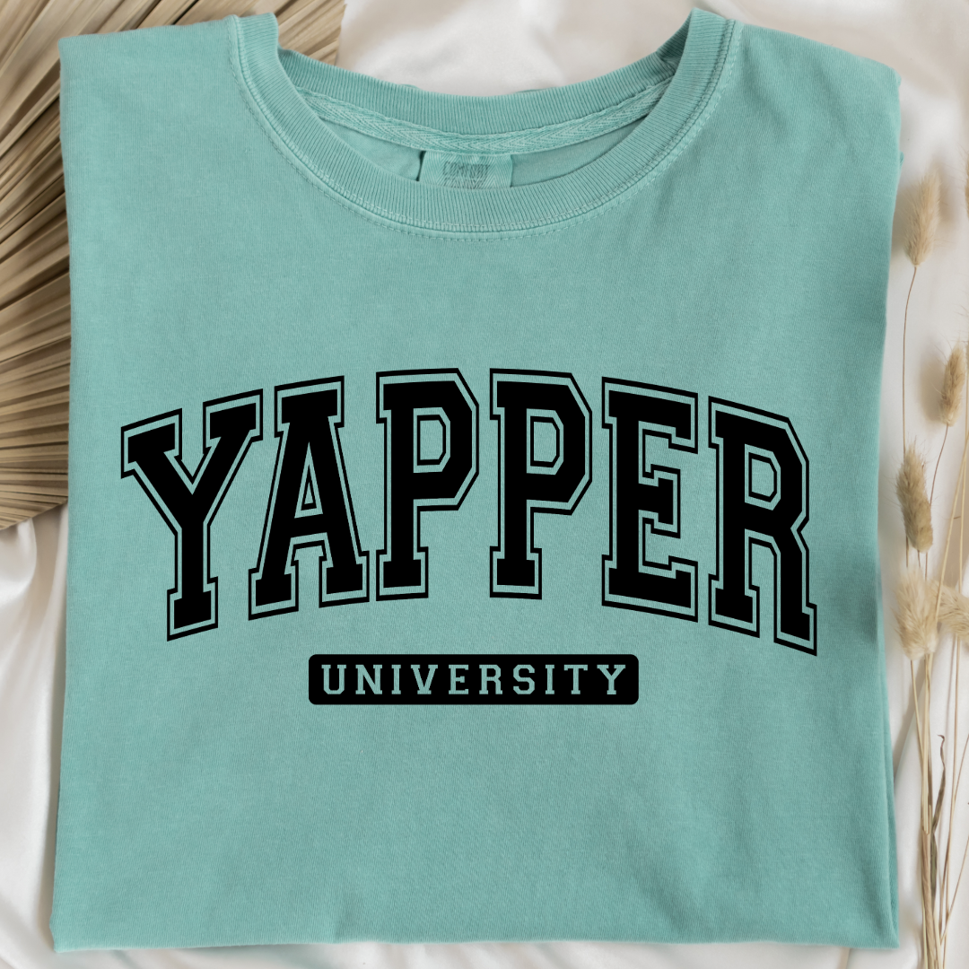 Customized adult comfort colors Chalky Mint Graphic tee with black varsity lettering yapper university Matching hoodies and crewnecks in adult and youth sizes available.