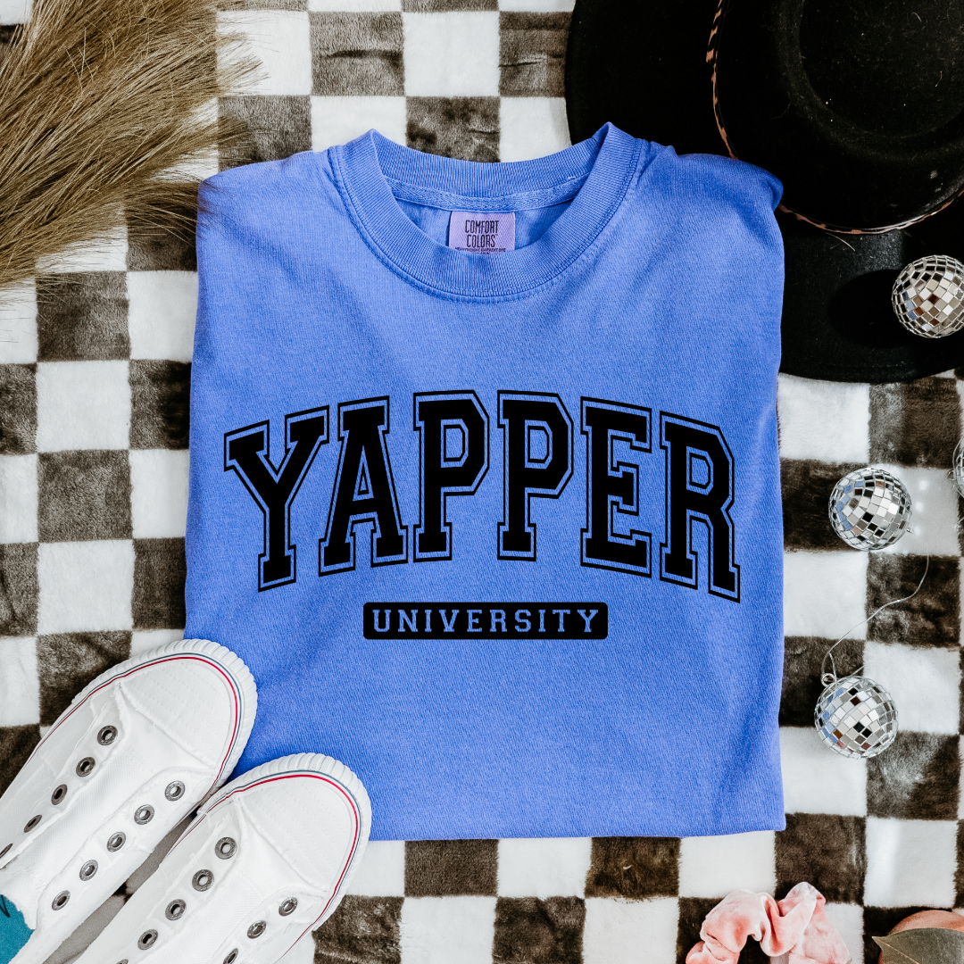 Customized Youth comfort colors Flo blue Graphic tee with black varsity lettering yapper university Matching hoodies and crewnecks in adult and youth sizes available.