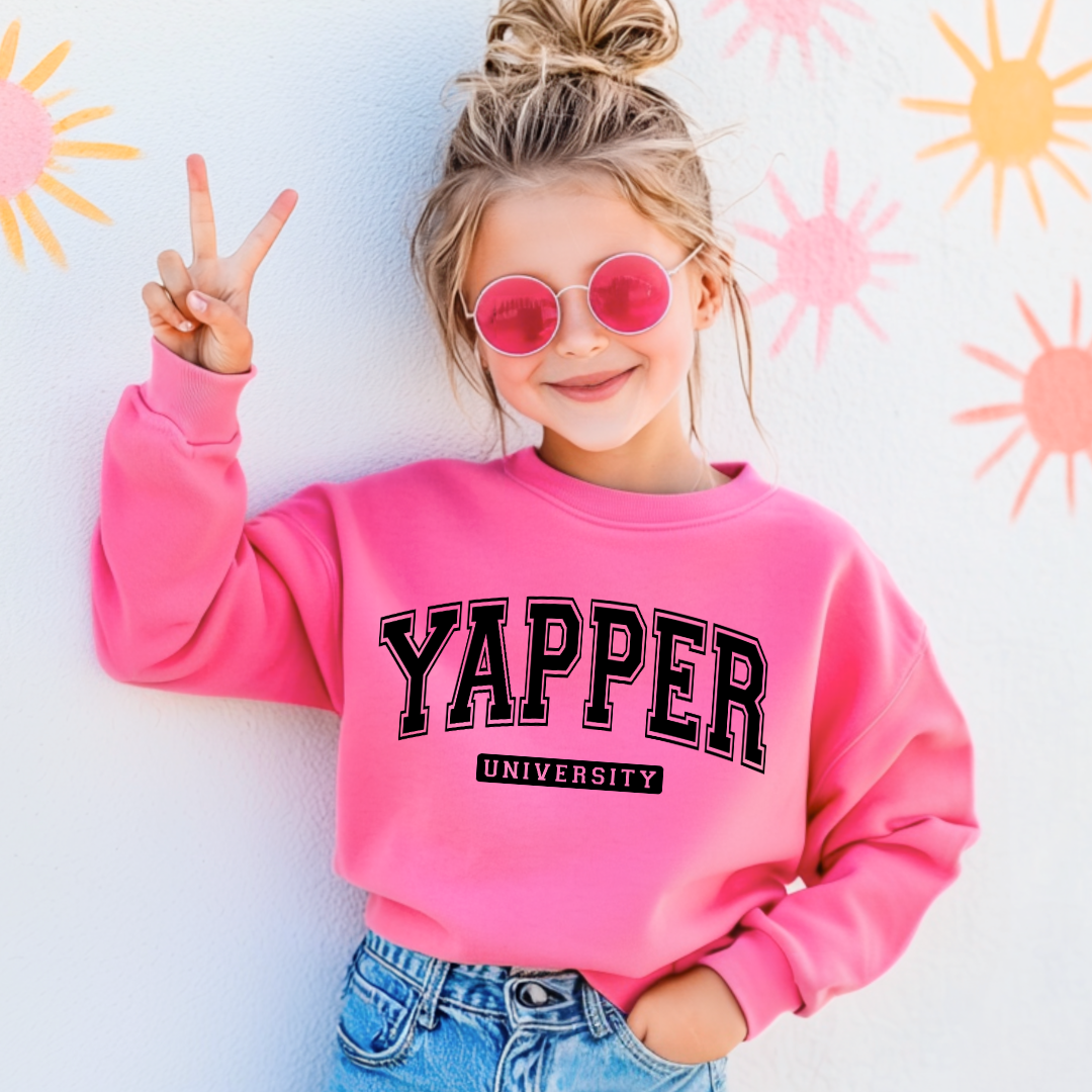 Customized youth Hot Pink Crewneck with black varsity lettering yapper university Matching hoodies and Graphic tees in adult and youth sizes available.