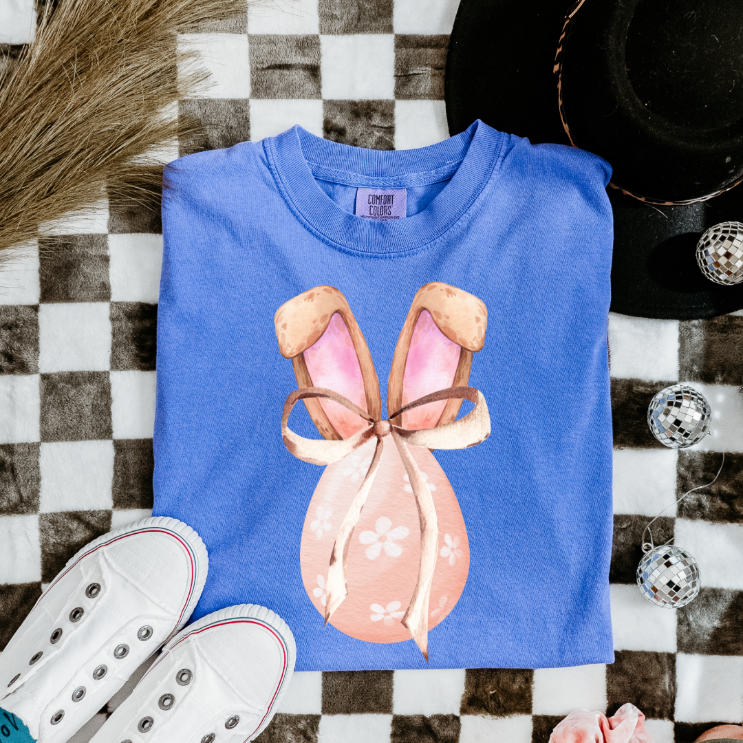 Customized adult/youth comfort colors flo blue watercolor peach egg with white flowers and brown floppy skinny bow and bunny ears matching crewneck and hoodies available In adult and youth sizes