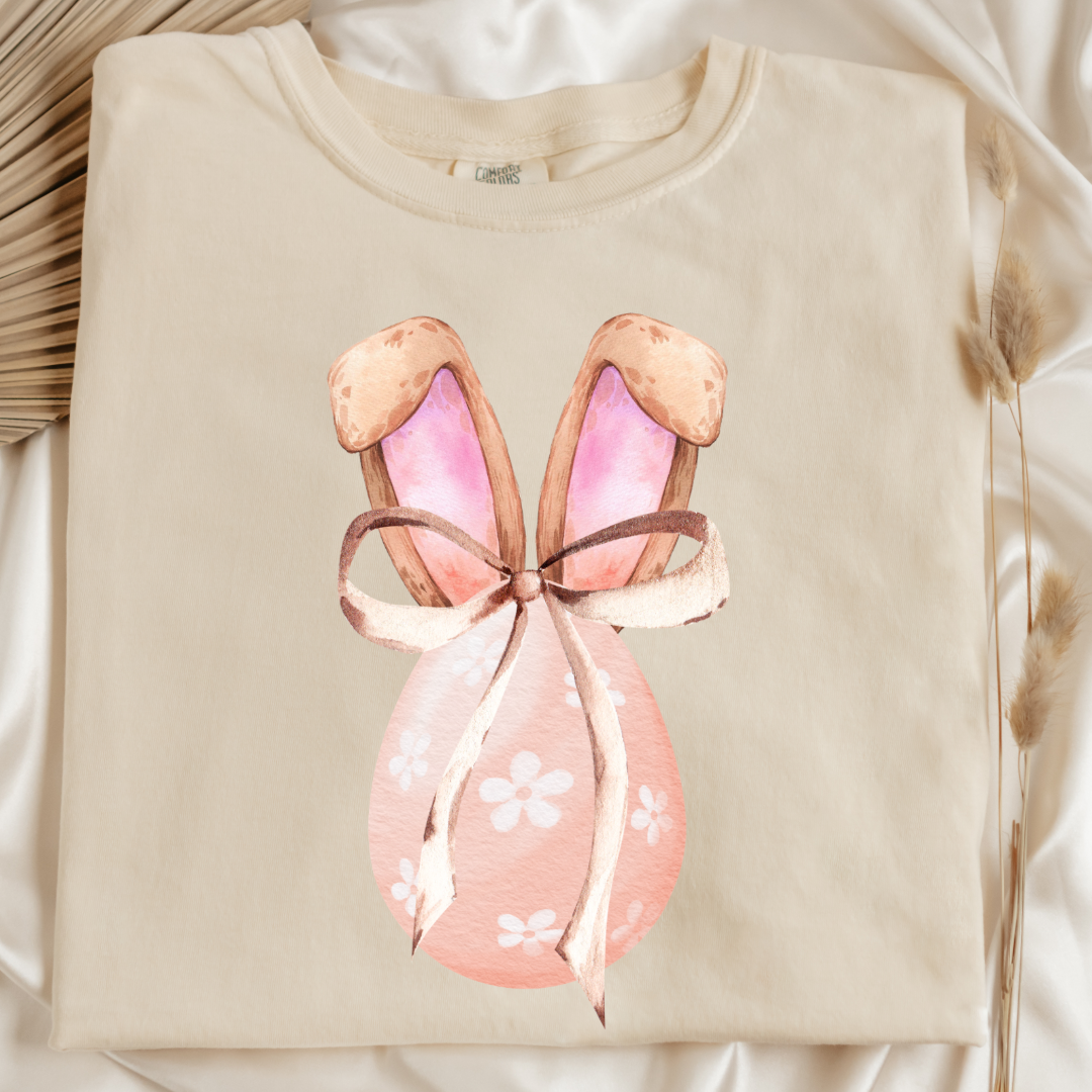 Customized adult comfort colors ivory flat lay watercolor peach egg with white flowers and brown floppy skinny bow and bunny ears matching crewneck and hoodies available In adult and youth sizes