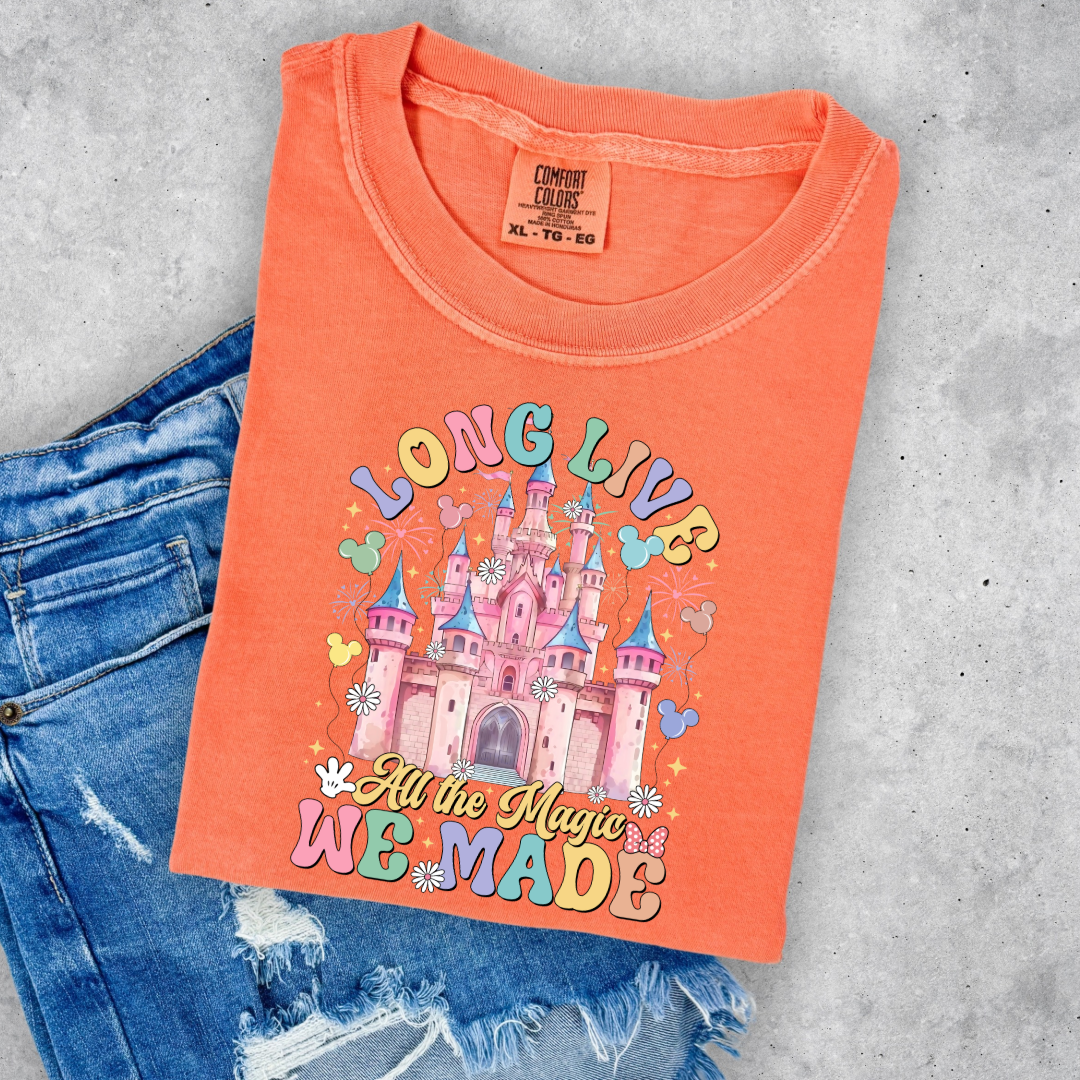 Customized adult comfort colors melon t-shirt with long live multi color long live bubble letters large castle in the middle with Mickey Mouse shaped balloons and flowers surrounding. Matching crewnecks and hoodies available in youth and adult sizes