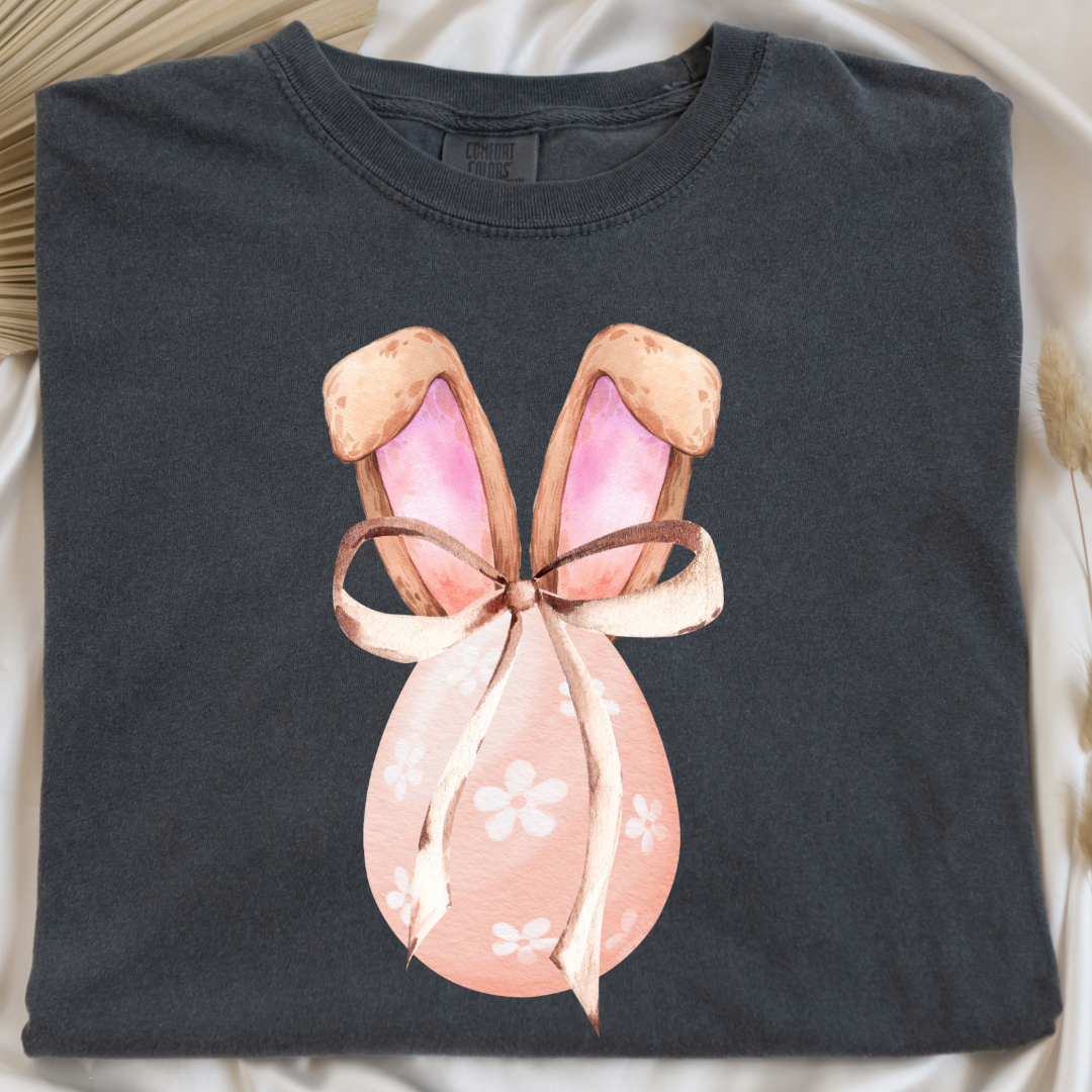 Customized adult comfort colors pepper vintage black watercolor peach egg with white flowers and brown floppy skinny bow and bunny ears matching crewneck and hoodies available In adult and youth sizes
