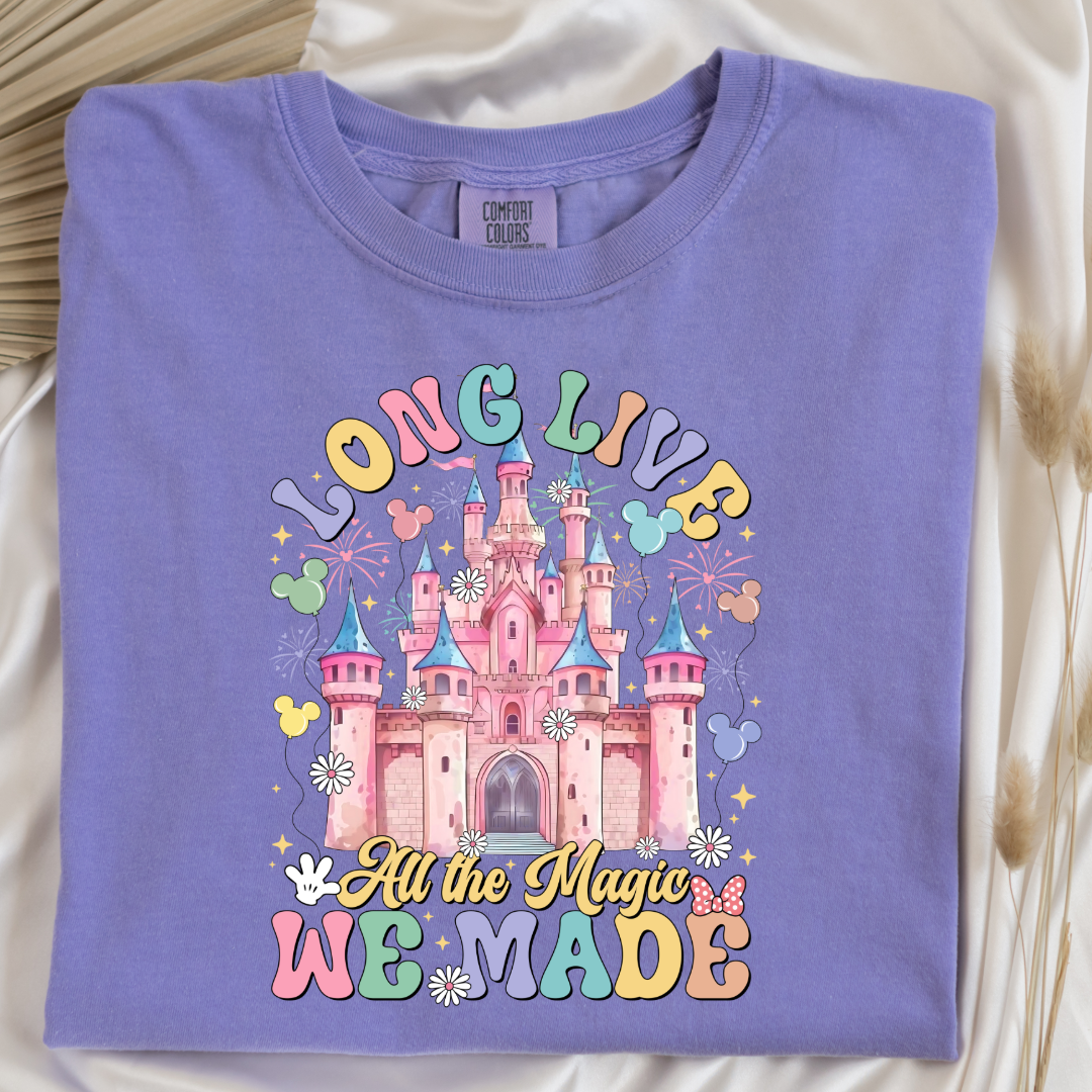 Customized adult comfort colors violet t-shirt with long live multi color long live bubble letters large castle in the middle with Mickey Mouse shaped balloons and flowers surrounding. Matching crewnecks and hoodies available in youth and adult sizes