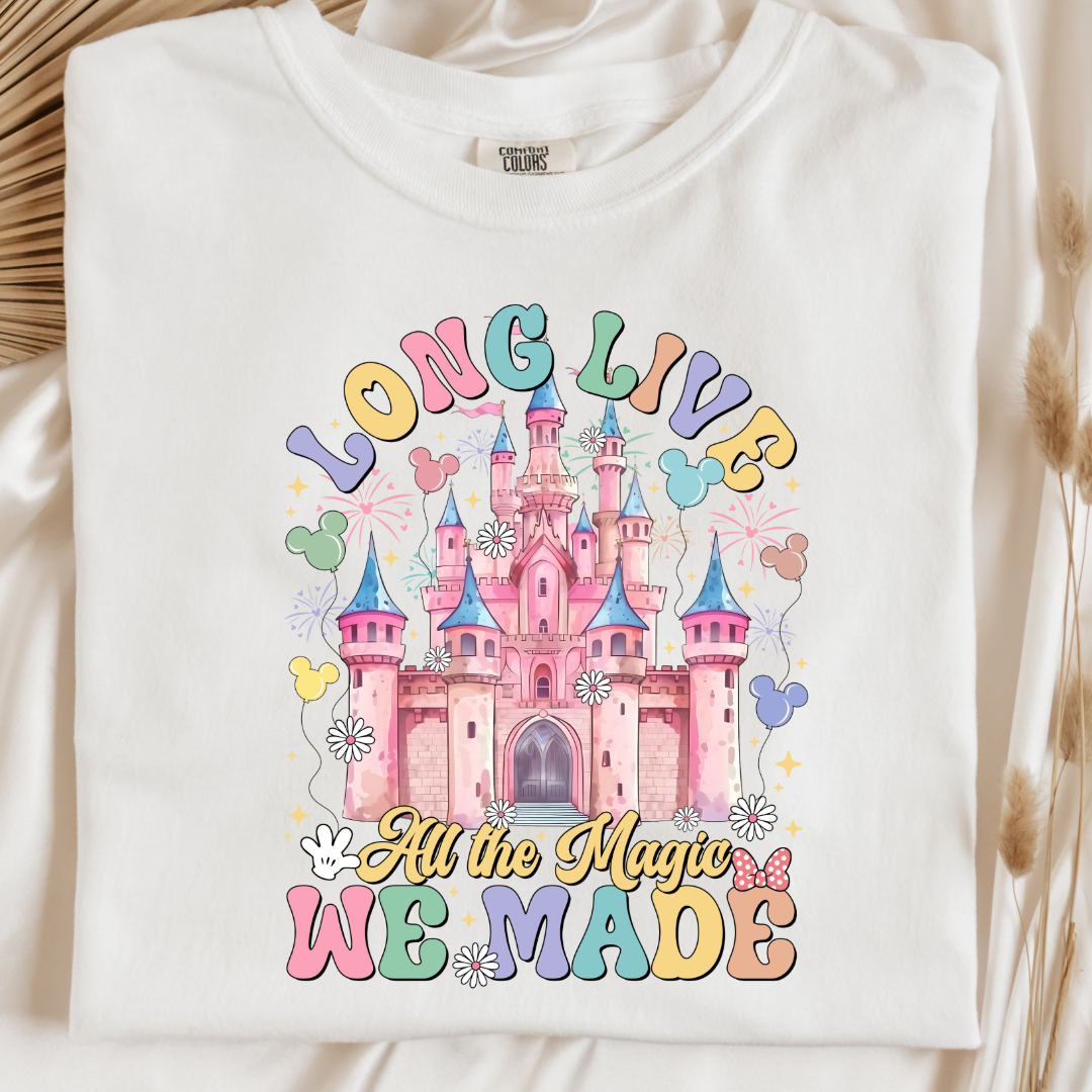 Customized adult comfort colors white t-shirt with long live multi color long live bubble letters large castle in the middle with Mickey Mouse shaped balloons and flowers surrounding. Matching crewnecks and hoodies available in youth and adult sizes