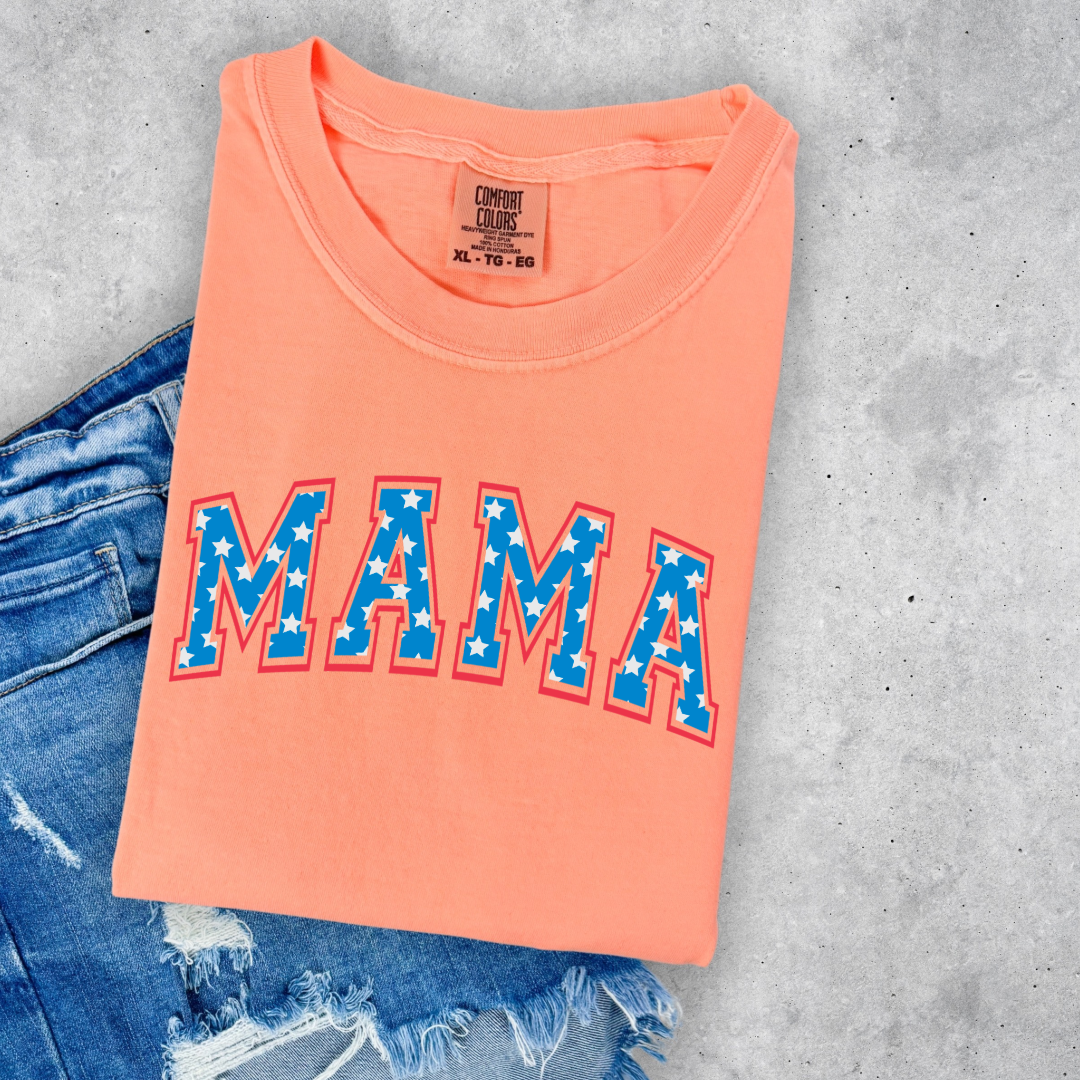 Customized adult Comfort Colors Neon Cantaloupoe Graphic Tee with Seasonal 4th of July University style Font MAMA blue with white stars outlined un red , This style is available in adult Graphic Tees as well as adult crewnecks and hoodies .Available In DAD, MAMA and MINI.