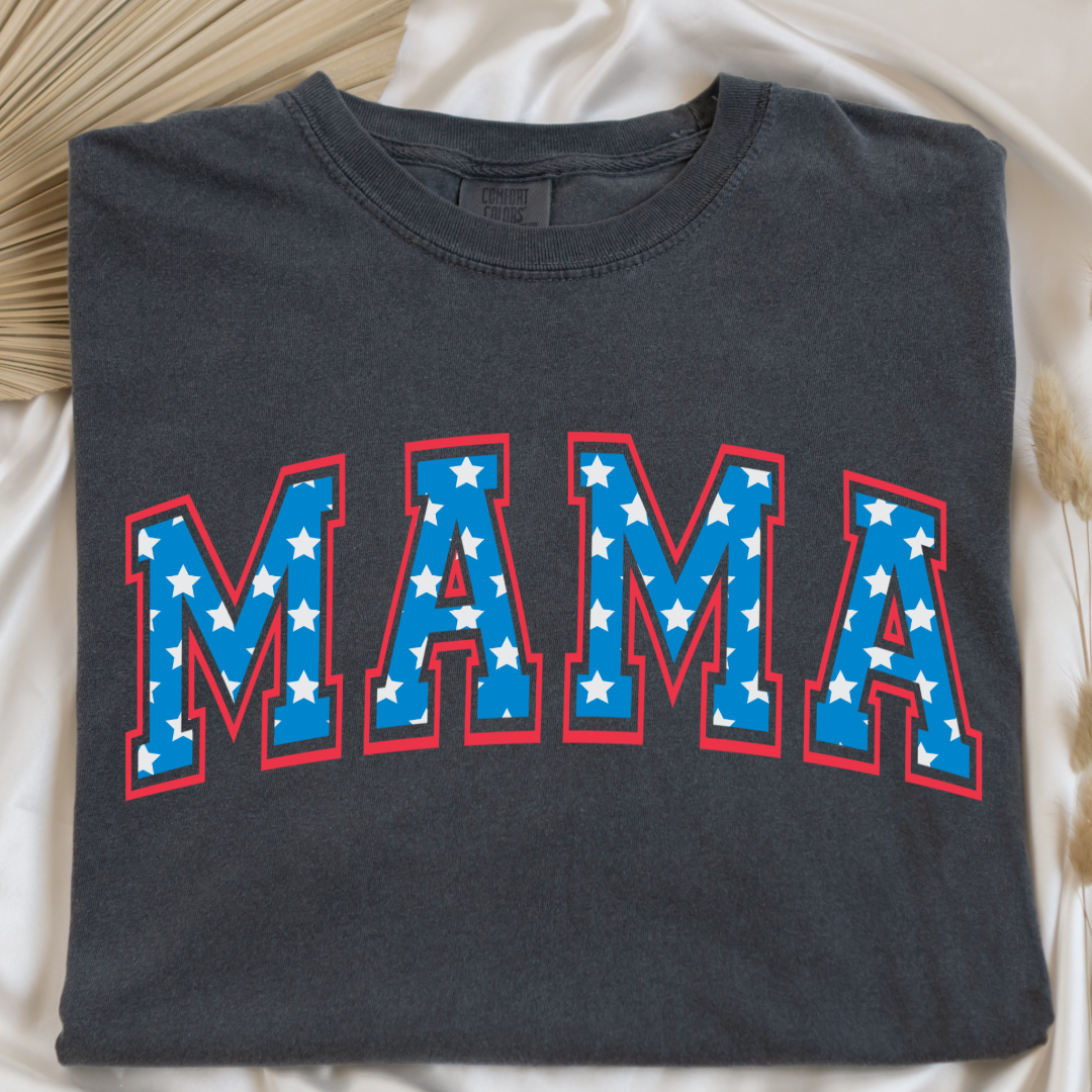 Customized adult Comfort Colors Pepper Vintage Black Graphic Tee with Seasonal 4th of July University style Font MAMA blue with white stars outlined un red , This style is available in adult Graphic Tees as well as adult crewnecks and hoodies .Available In DAD, MAMA and MINI.