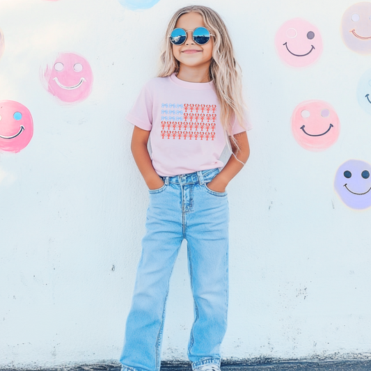 Customized comfort colors youth Blossom Pink Graphic tee with American Flag made of blue bows and red lobsters. Perfect for 4th of July Ranging in sizes youth Small to adult 4X also comes in matching hoodies and crewnecks.