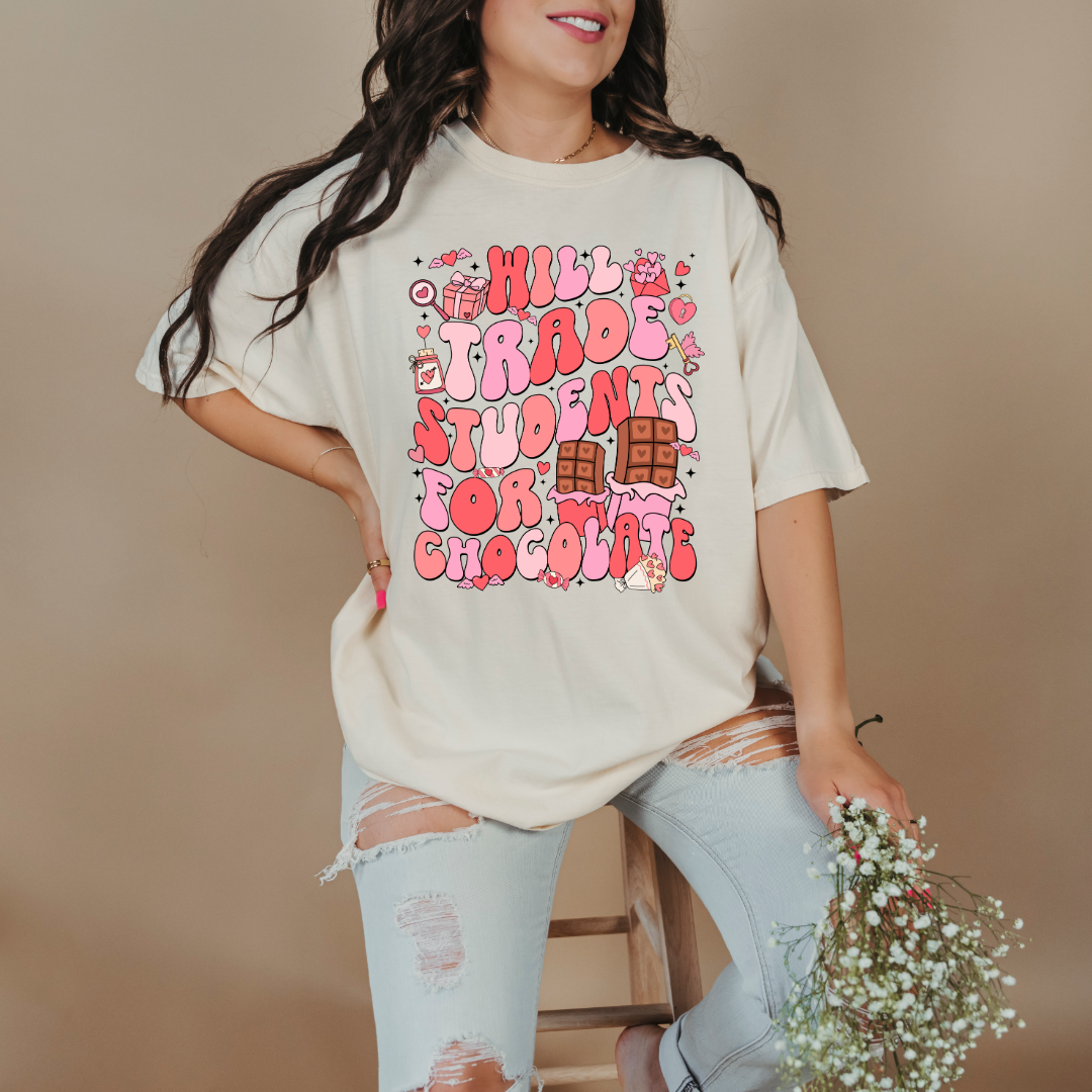 Customized adult Ivory Graphic Tee will trade students for chocolate bubble letters pink and red