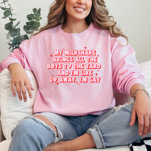 Customized Adult Light Pink Crewneck with pink and red bubble letters quoting "my milkshakes bring all the boys to the yard and im like go away im gay" with hearts good for pride month matching adult Graphic Tees Available. 