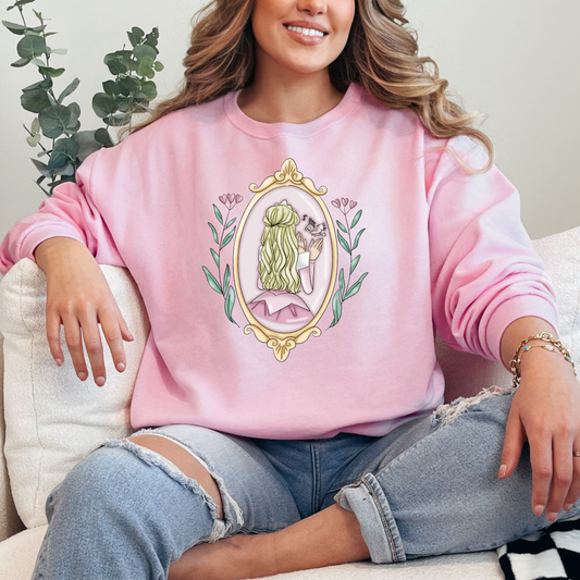 Customized adult light pink crewneck Disney Princess sleeping beauty/Aurora back silhouette in a gold mirror with flower vines up the side. Designs are available in Adult and youth graphic tees as well as youth and adult crewnecks and adult hoodies. 