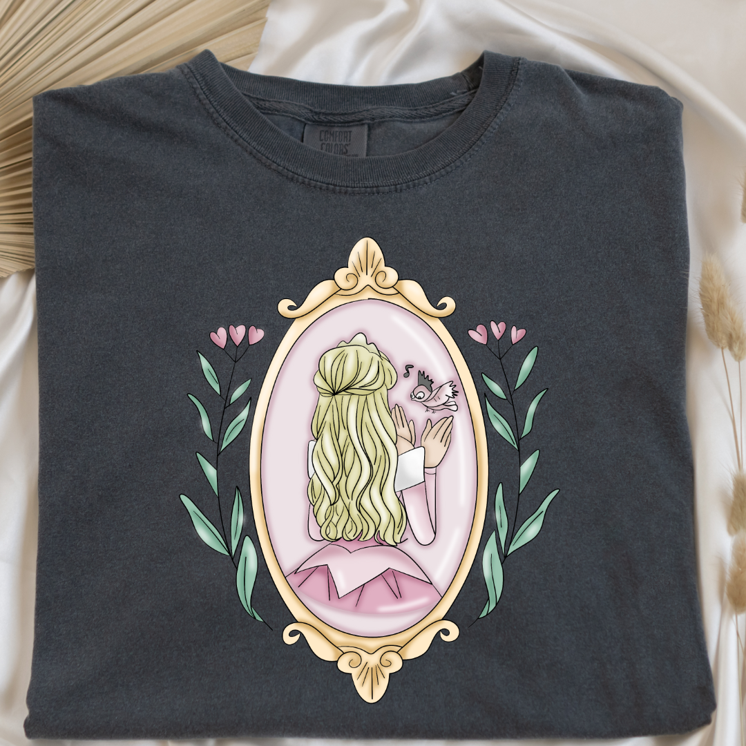 Customized comfort colors pepper vintage black Graphic tee Disney Princess sleeping beauty/Aurora back silhouette in a gold mirror with flower vines up the side. Designs are available in Adult and youth graphic tees as well as youth and adult crewnecks and adult hoodies. 