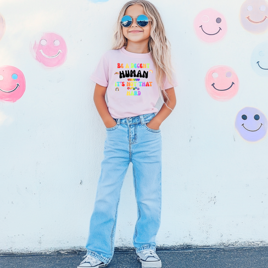 Customized youth comfort colors blossom pink graphic tee rainbow bubble letters "be a decent human it’s not that hard." Matching Graphic tees, hoodies, and crewnecks available in youth and adult sizing. 