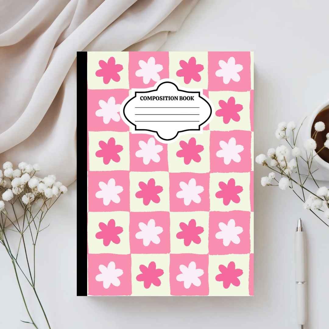 Composition book with pink and white floral pattern on a light background