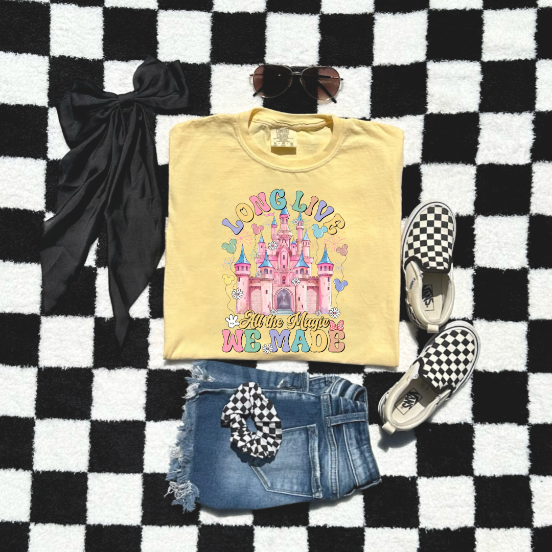 Customized Youth comfort colors Butter yellow t-shirt with long live multi color long live bubble letters large castle in the middle with Mickey Mouse shaped balloons and flowers surrounding. Matching crewnecks and hoodies available in youth and adult sizes 
