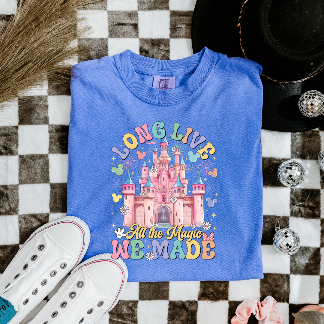 Customized Youth comfort colors Flo Blue t-shirt with long live multi color long live bubble letters large castle in the middle with Mickey Mouse shaped balloons and flowers surrounding. Matching crewnecks and hoodies available in youth and adult sizes 