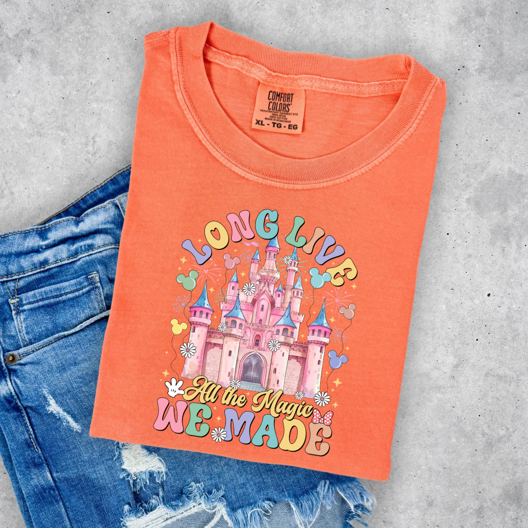 Customized Youth comfort colors Melon t-shirt with long live multi color long live bubble letters large castle in the middle with Mickey Mouse shaped balloons and flowers surrounding. Matching crewnecks and hoodies available in youth and adult sizes 
