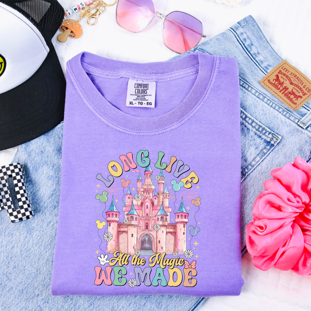 Customized Youth comfort colors Violet t-shirt with long live multi color long live bubble letters large castle in the middle with Mickey Mouse shaped balloons and flowers surrounding. Matching crewnecks and hoodies available in youth and adult sizes 