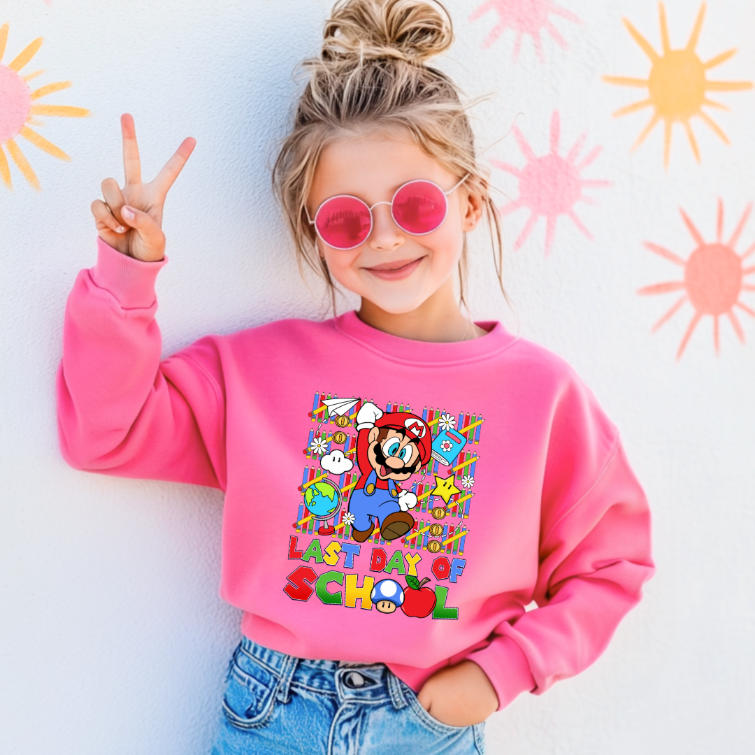 Customized Youth hot pink comfort colors graphic tee. Last day of school Mario Nintendo world bubble letter font. With clouds Matching graphic tees available in youth sizing.