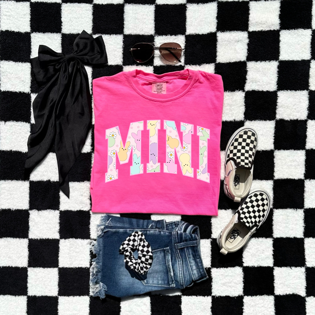 Customized youth mini of a mama and mini matching set varsity lettering with Patel peeps on the inside of the lettering matching youth crewnecks available comfort colors neon pink graphic tee 