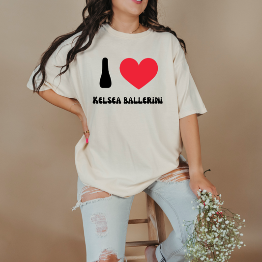 Customized Adult comfort colors ivory graphic tee with black groovy bubble letters I red heart Kelsea Ballerini. Matching crewneck and hoodies available in youth and adult sizing.