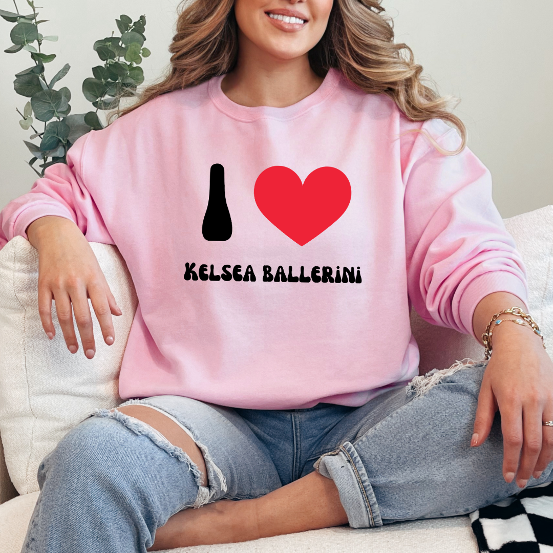 Customized Adult Light pink Crewneck with black groovy bubble letters I red heart Kelsea Ballerini. Matching crewneck and hoodies available in youth and adult sizing.