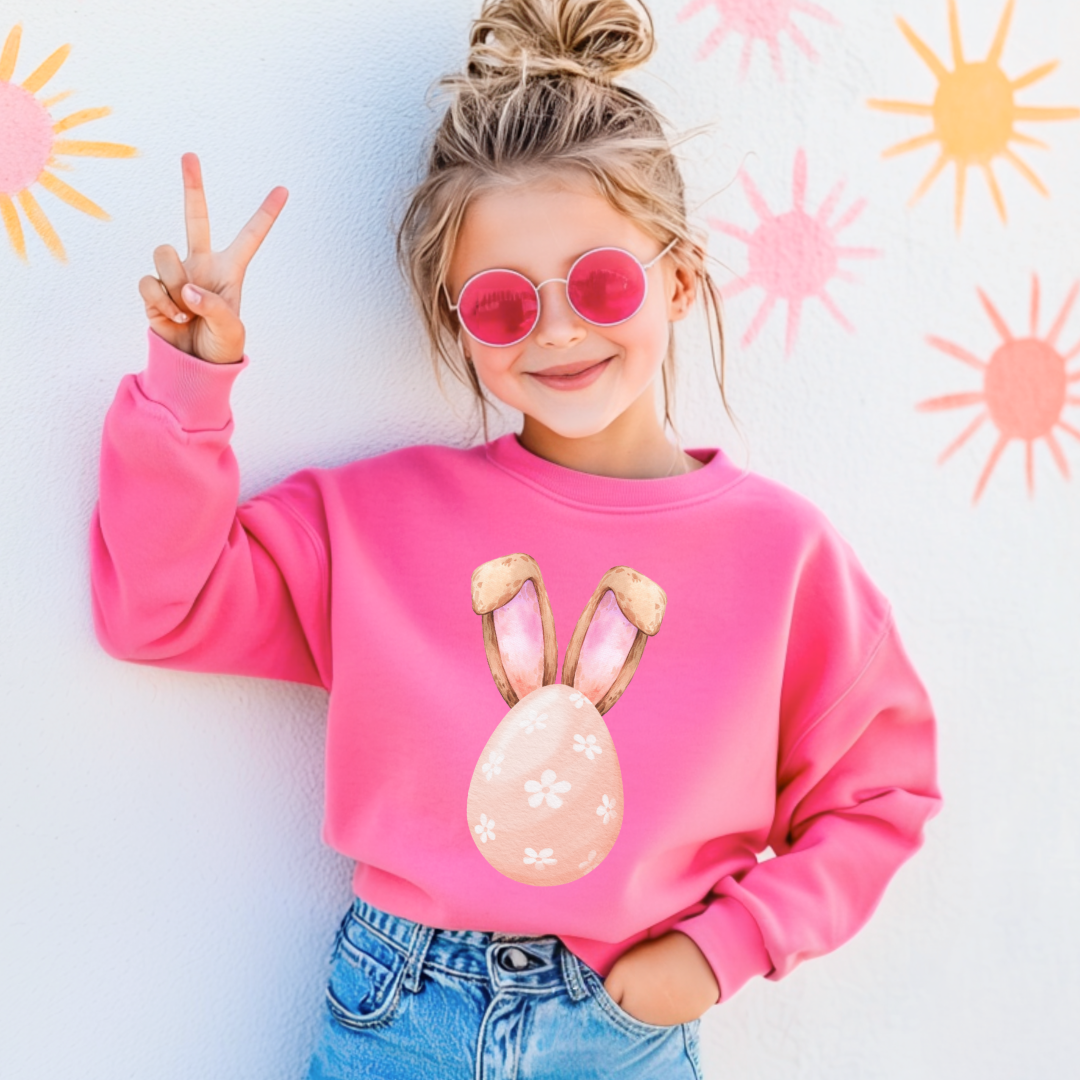 Customized youth hot pink crewneck watercolor peach egg with white flowers and bunny ears matching tees and hoodies available In adult and youth sizes 